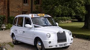 London Taxi TX4 Wedding car. Click for more information.